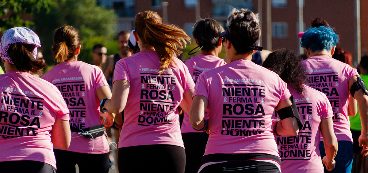 Women participate in a run to support breast cancer research.