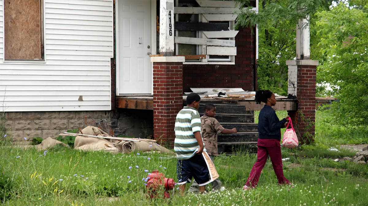 Black children walking in their neighborhood.