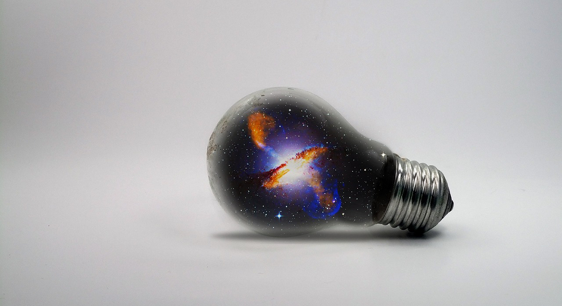 Graphic of a galaxy inside a light bulb.