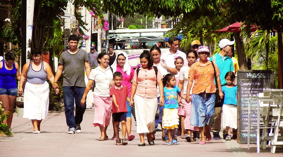 Latino family walking together.