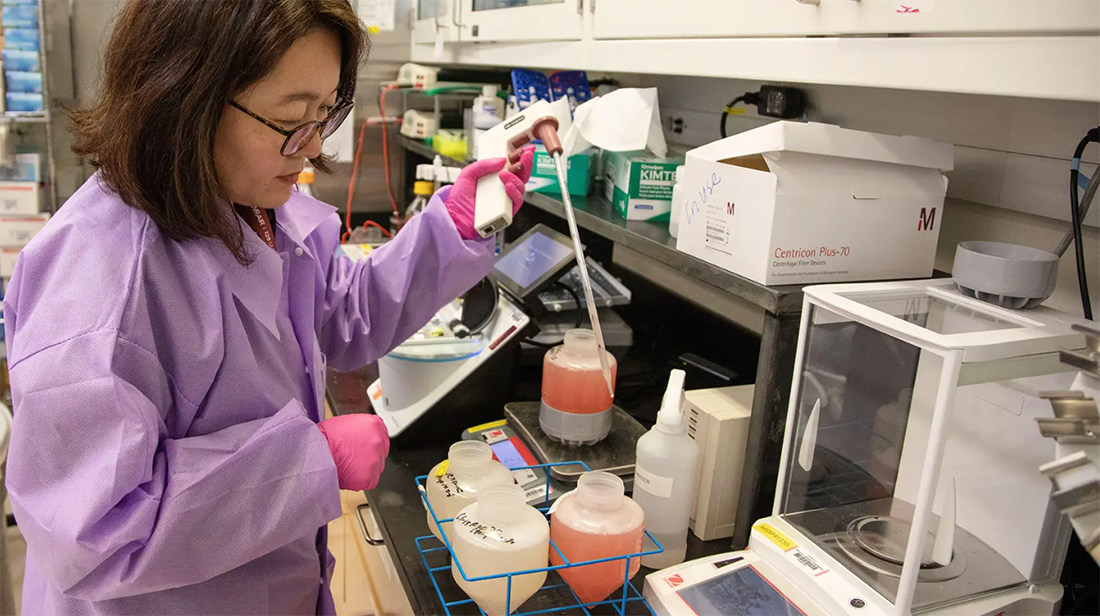 Clinical researcher working in a lab.
