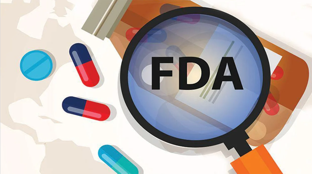 Graphic of a magnifying glass, with 'FDA' in the middle, examining some pills.