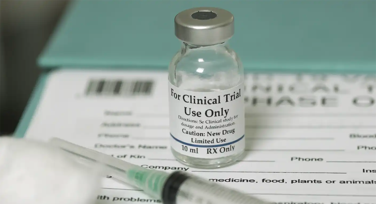 A vial of vaccine and a syringe