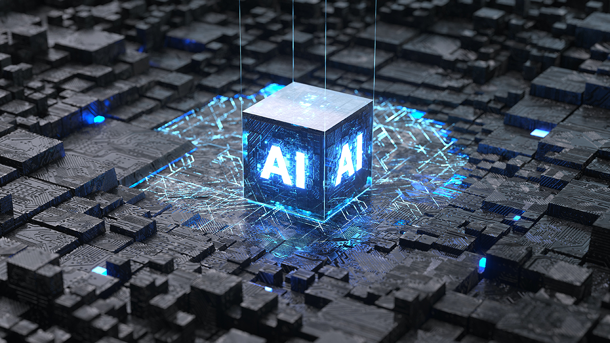A cube with "AI" illuminated is in tehe middle of some black computer chips.