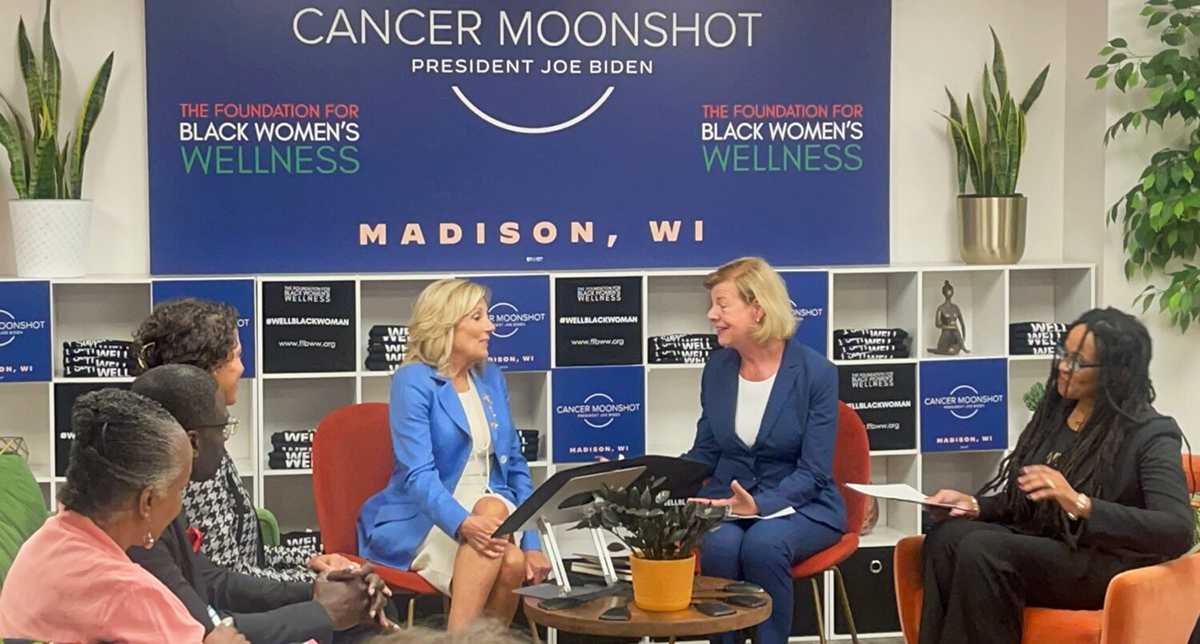 United States First Lady Dr. Jill Biden speaks to Senator Tammy Baldwin, Foundation For Black Women's Wellness founder Lisa Peyton-Caire, and other community health leaders at the Foundation For Black Women's Wellness.