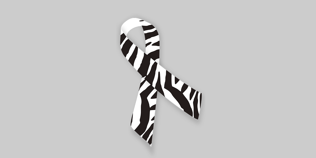 Zebra-colored ribbon on a gray background.