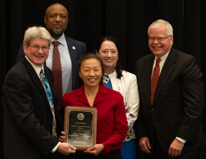 Pictured (left to right): UW Regent Jim Kreuser; UW–Madison Provost Charles Isbell; Lynda Bader; UW Regent Karen Walsh; Jay Rothman, president, Universities of Wisconsin.