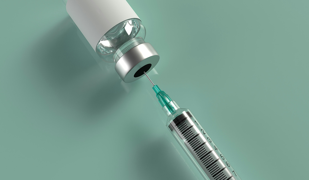 A syringe and vial.